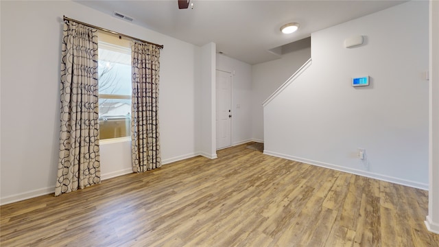 unfurnished room with light hardwood / wood-style floors