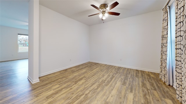 unfurnished room featuring hardwood / wood-style flooring and ceiling fan