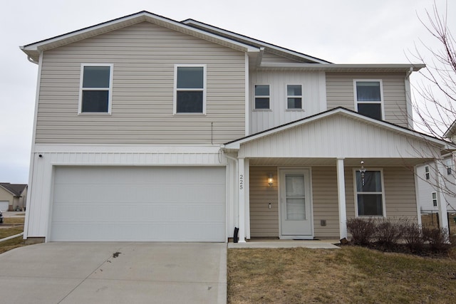 view of front of home with a porch, a garage, and a front yard