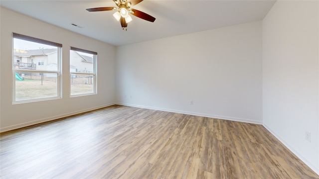 empty room featuring ceiling fan and wood-type flooring