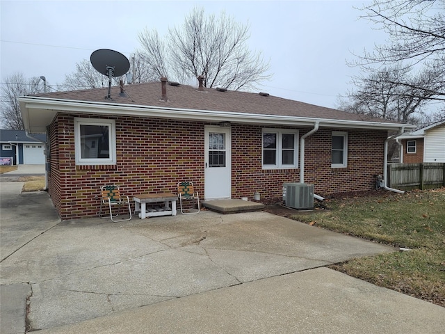 back of house with a patio and central AC unit