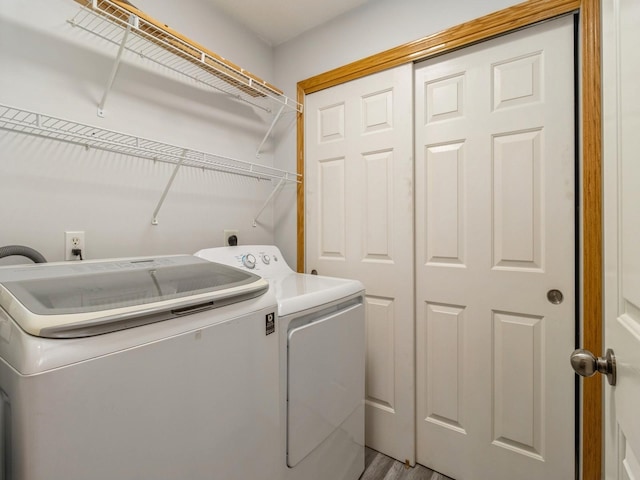 washroom featuring independent washer and dryer