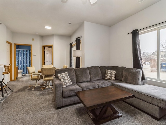 living room with a healthy amount of sunlight and carpet