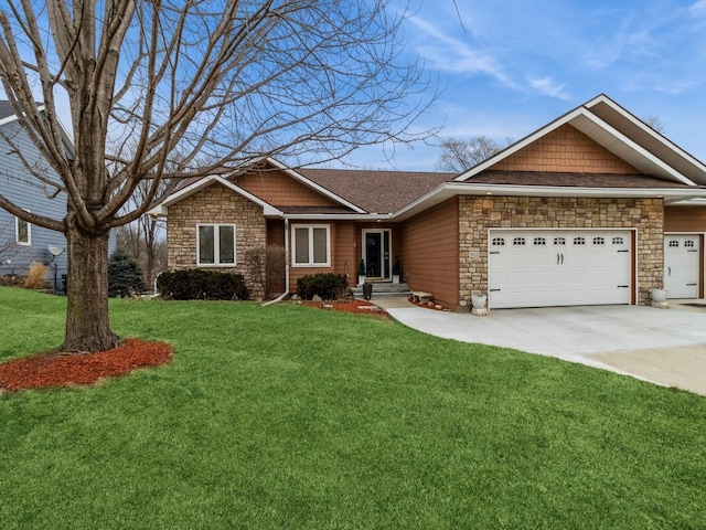 view of front of house featuring a garage and a front yard