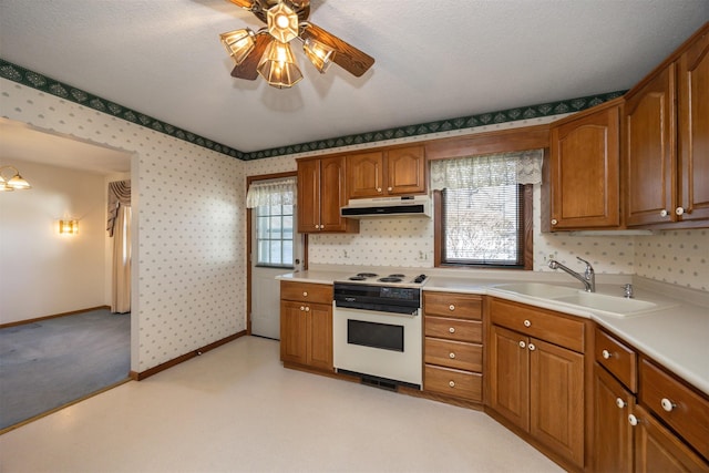 kitchen featuring sink, a textured ceiling, ceiling fan, and white electric range oven