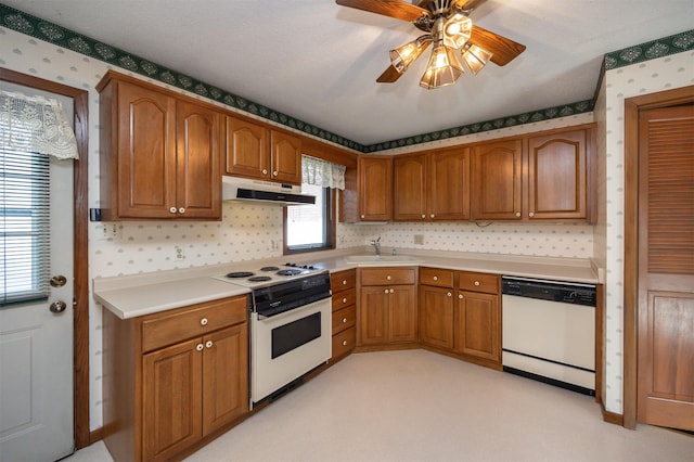 kitchen with sink, white appliances, and ceiling fan