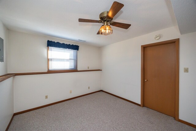 carpeted empty room with ceiling fan