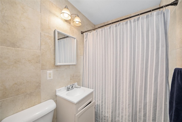 bathroom featuring vanity, tile walls, a shower with shower curtain, and toilet