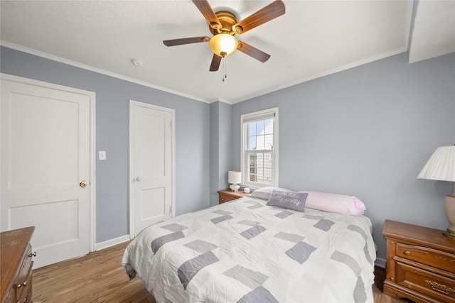 bedroom with crown molding, ceiling fan, and light wood-type flooring