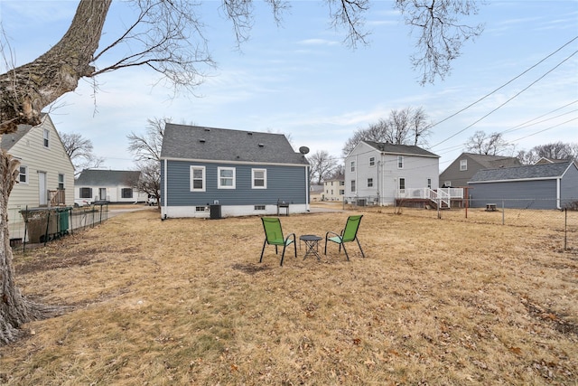 back of property featuring a yard