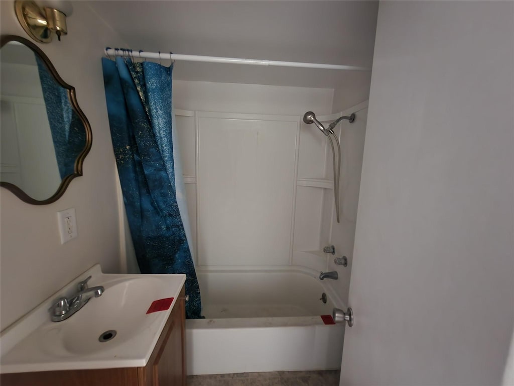 bathroom with vanity and shower / bath combo