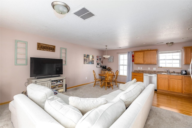 living room with sink and a textured ceiling