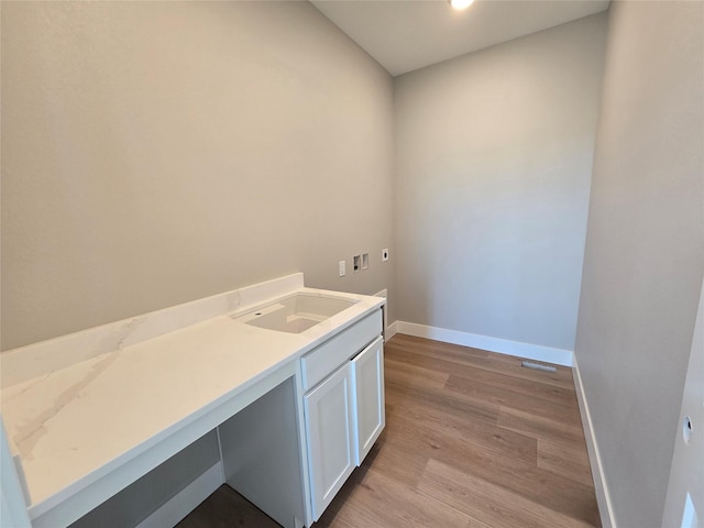16207 Goodman Dr, Urbandale, IA 50323 - washroom with baseboards, light wood finished floors, and hookup for a washing machine