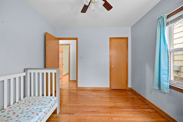 bedroom featuring light hardwood / wood-style floors and ceiling fan