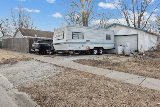 view of side of home featuring a garage