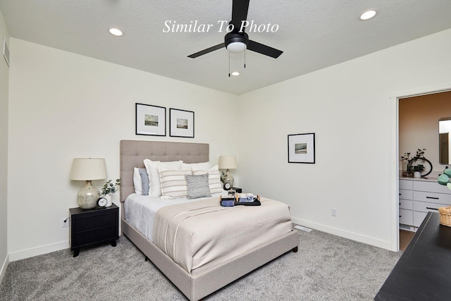 bedroom with recessed lighting, baseboards, carpet floors, and a textured ceiling