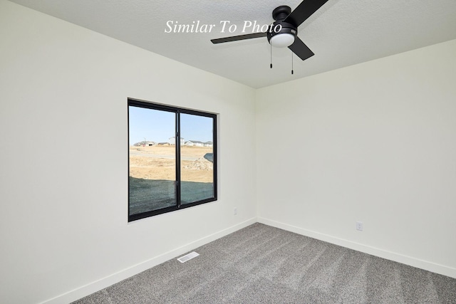 unfurnished room featuring visible vents, a ceiling fan, a textured ceiling, carpet floors, and baseboards