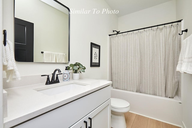 full bathroom with vanity, shower / bath combination with curtain, toilet, and wood finished floors
