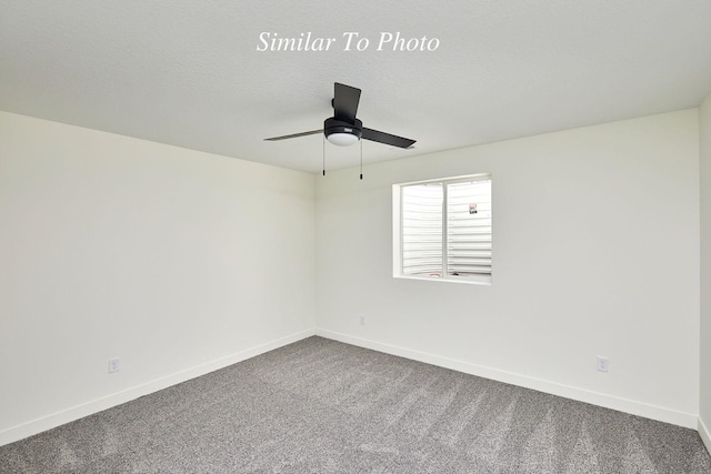 unfurnished room with a textured ceiling, baseboards, dark carpet, and ceiling fan