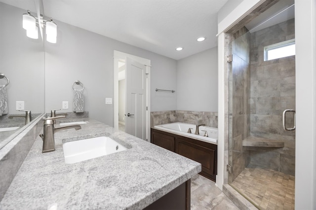 bathroom featuring vanity and plus walk in shower