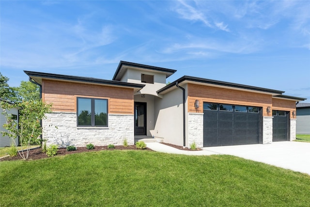 741 Richland Ct, Van Meter, IA 50261 - view of front of home featuring a garage, stone siding, driveway, a front yard, and stucco siding