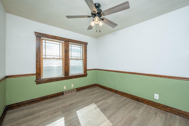 unfurnished room with ceiling fan and light hardwood / wood-style flooring