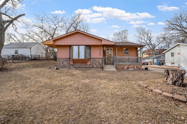 view of front facade featuring a front yard and a porch