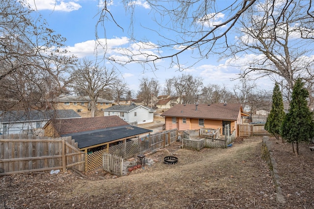 back of property featuring a fire pit