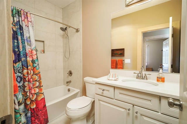 full bathroom with vanity, shower / bath combination with curtain, and toilet