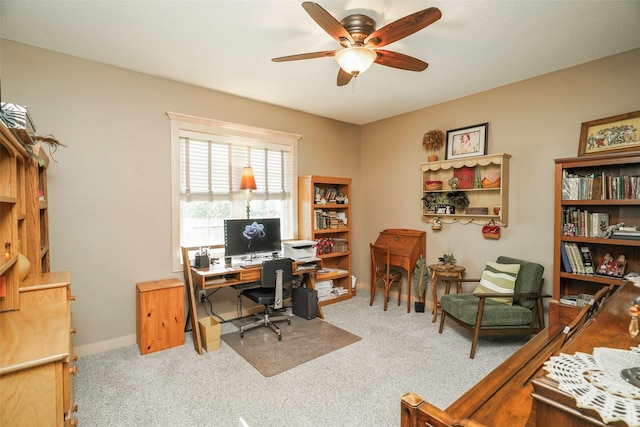 office space with ceiling fan and carpet