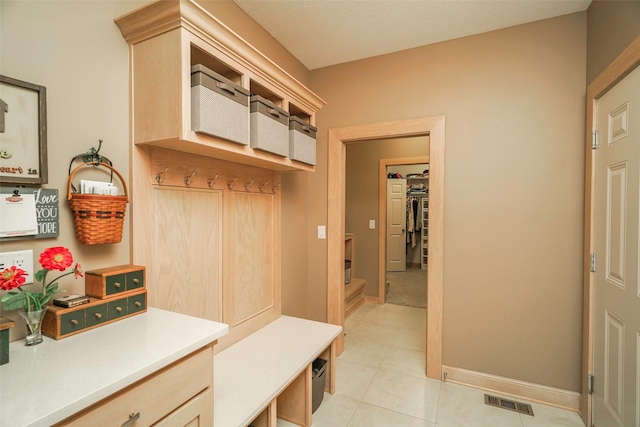 mudroom featuring light tile patterned floors