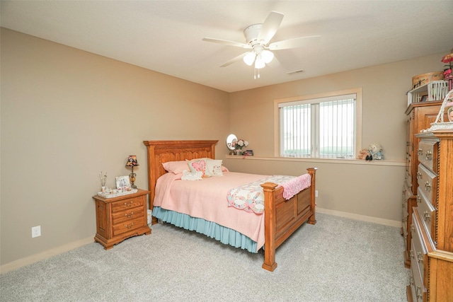 bedroom featuring ceiling fan and light carpet