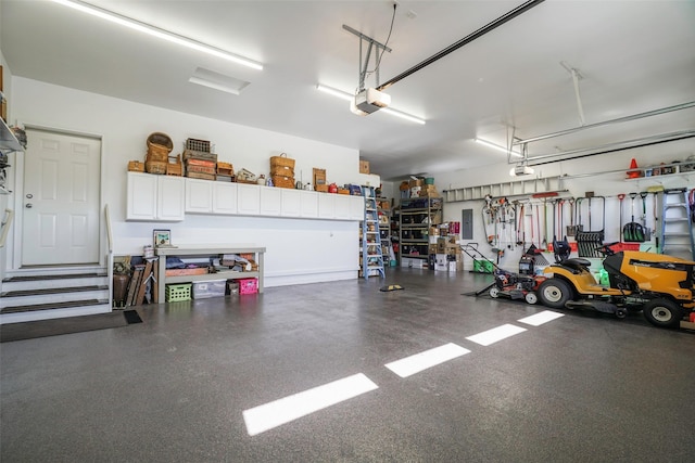 garage featuring a garage door opener and electric panel