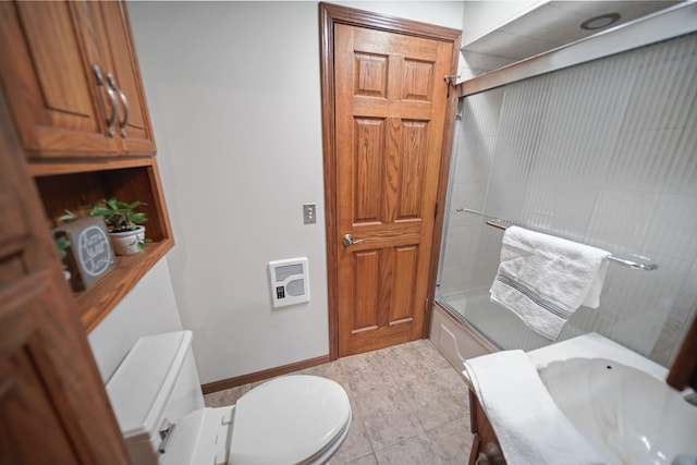 full bath with tile patterned flooring, toilet, shower / bath combination with glass door, baseboards, and heating unit