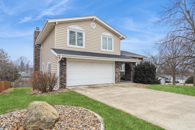 view of property with a garage and a front yard