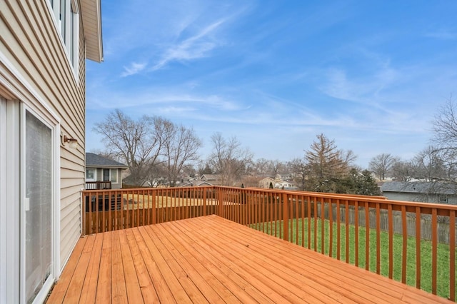 wooden terrace with a lawn