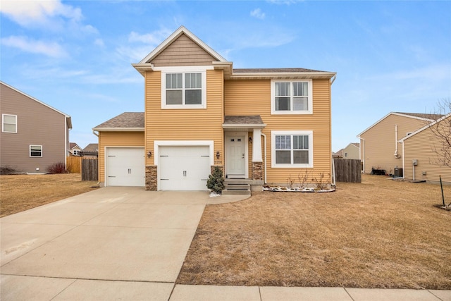 view of property featuring central AC, a garage, and a front lawn