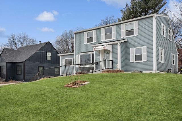 view of property featuring a front lawn