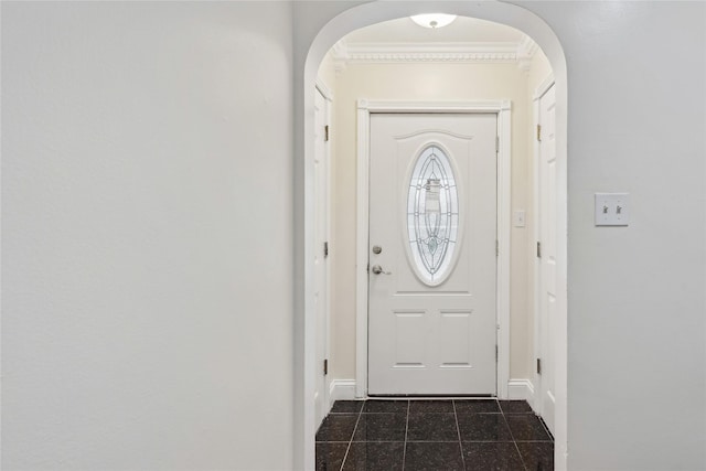 doorway to outside with ornamental molding