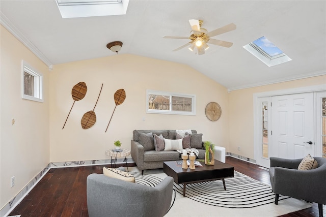 living room with crown molding, ceiling fan, wood-type flooring, and vaulted ceiling with skylight