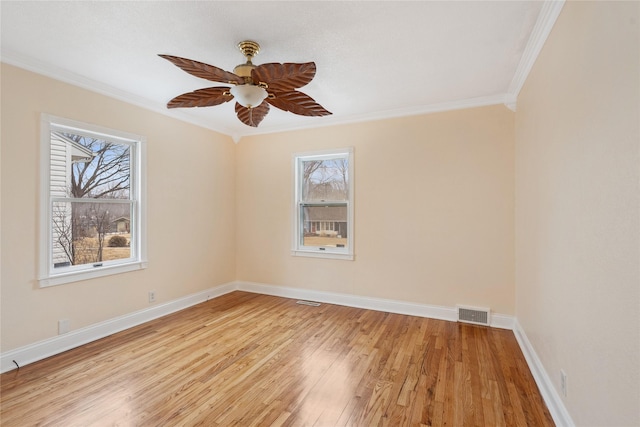 unfurnished room with crown molding, ceiling fan, and light hardwood / wood-style floors