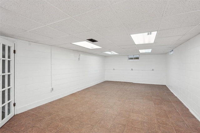 spare room featuring a drop ceiling