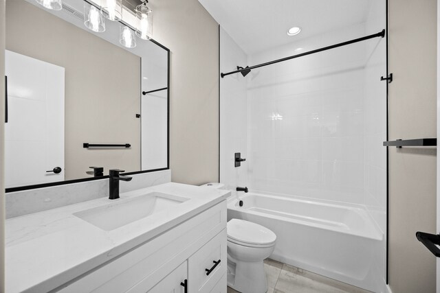 bathroom with  shower combination, vanity, and toilet