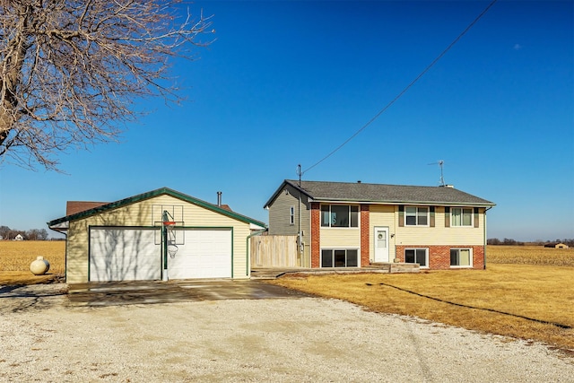 view of front of property with a garage and an outdoor structure