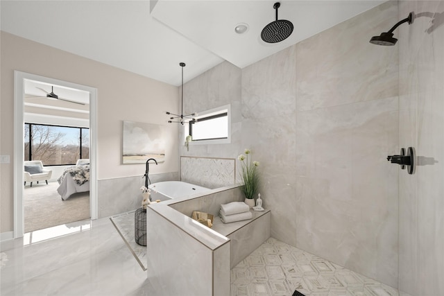 bathroom with tile walls and independent shower and bath