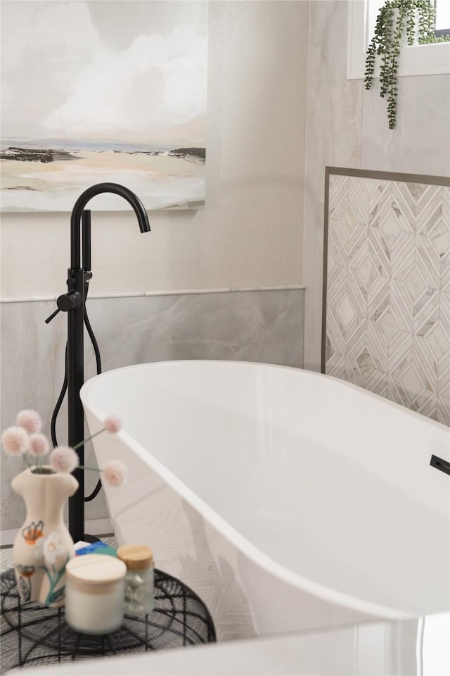 bathroom with a tub to relax in