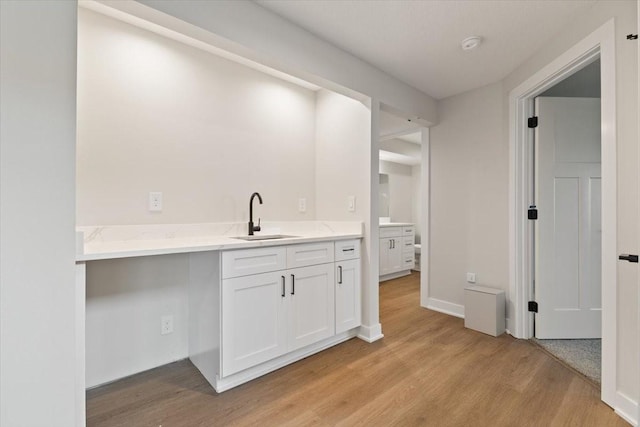 625 NW Georgetown Dr, Waukee, IA 50263 - bar area featuring a sink and light wood-style floors