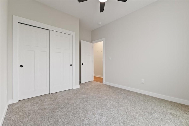 625 NW Georgetown Dr, Waukee, IA 50263 - unfurnished bedroom featuring carpet, a closet, and a ceiling fan