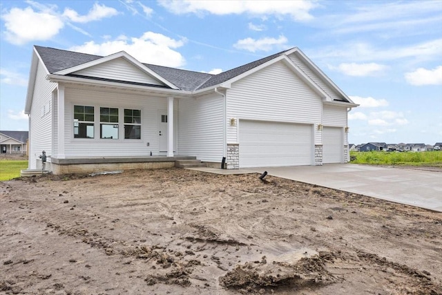 625 NW Georgetown Dr, Waukee, IA 50263 - ranch-style home with an attached garage, a porch, driveway, and roof with shingles