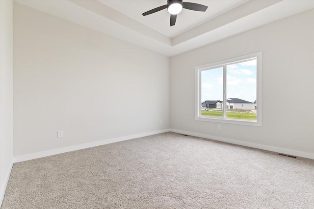 625 NW Georgetown Dr, Waukee, IA 50263 - carpeted empty room with ceiling fan and a tray ceiling